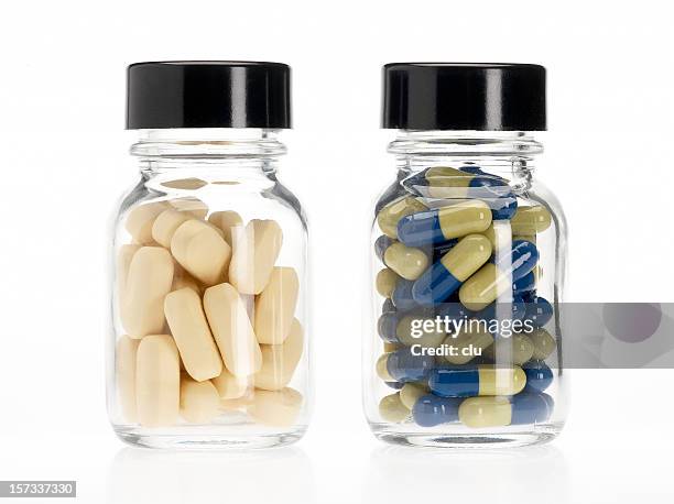 A collection of vitamin and supplement bottles on a clean neutral background